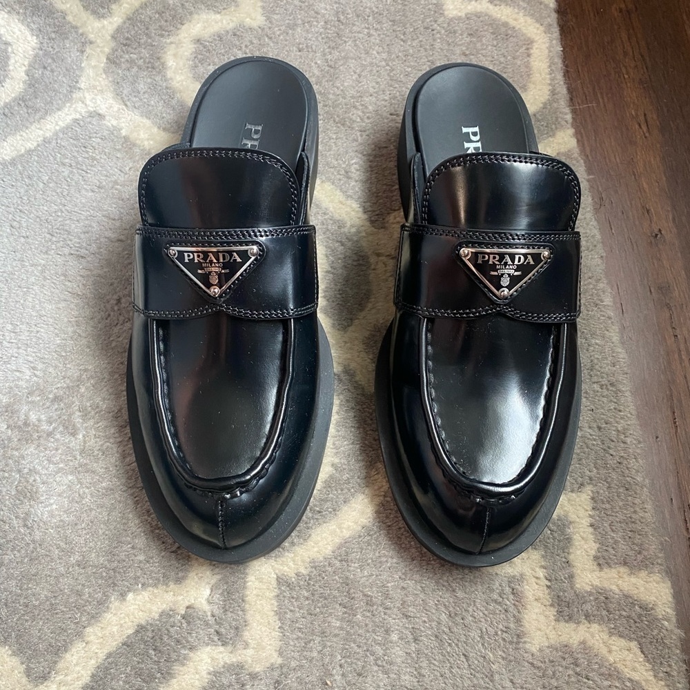 Prada Black Leather Slip-On Mules with Silver Logo